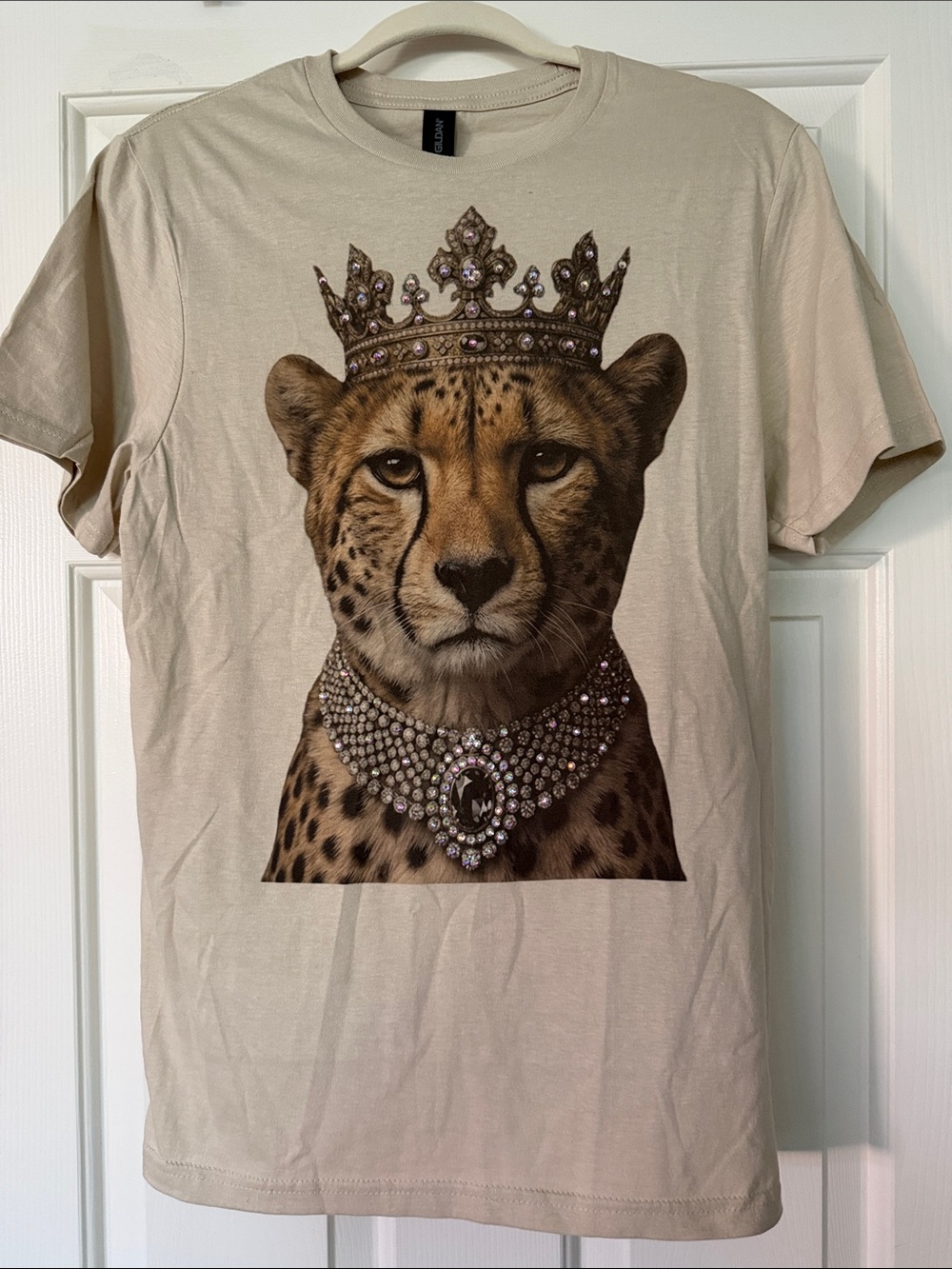 Beige Crew Neck T‑Shirt with rhinestone embellishments.